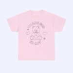 The Thank God I'm Gay Shirt is a light pink LGBTQ tee with a line drawing of a teddy bear surrounded by hearts and flowers, plus "THANK GOD IM GAY" text—perfect for expressing pride.