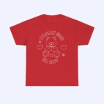 Thank God I'm Gay Shirt: Red tee featuring a white outline teddy bear with hearts and flowers, plus "THANK GOD IM GAY" text—bold, playful, and perfect for celebrating pride and self-love.