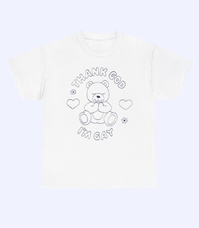 Show your pride in the Thank God I'm Gay Shirt—a white tee with a line drawing of a teddy bear, hearts, and flowers, plus bold "THANK GOD I'M GAY" text above and below the design.