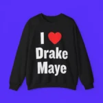 The I Love Drake Maye Shirt is black, featuring "I ♥ Drake Maye" in large white letters with a red heart, shown on a bright blue background.