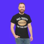 A bearded man stands against a bright blue background, wearing a black No Teeth Destination Smokehouse For This Meat Shirt with the DESTINATION SMOKEHOUSE logo in the center.