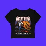The Angry Runs Bills James Cook III Shirt is a black crop top with an illustration of James Cook III running, "ANGRY RUNS" text above, a roaring lion in the background, plus Buffalo Bills and NFL logos.