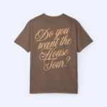 A Sabrina Carpenter House Tour Shirt in brown is shown laid flat, featuring “Do you want the House Tour?” in large decorative beige script on the back.