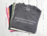 No Human Is Illegal on Stolen Land Tee – Retro Activist Shirt