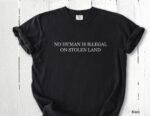 No Human Is Illegal on Stolen Land Tee – Retro Activist Shirt