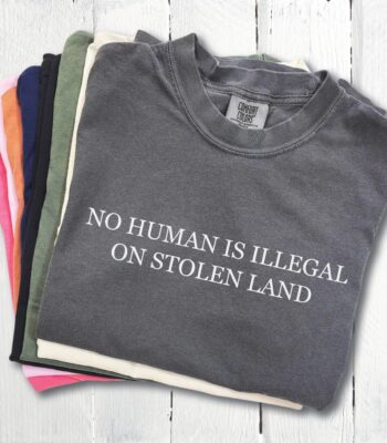 No Human Is Illegal on Stolen Land Tee – Retro Activist Shirt